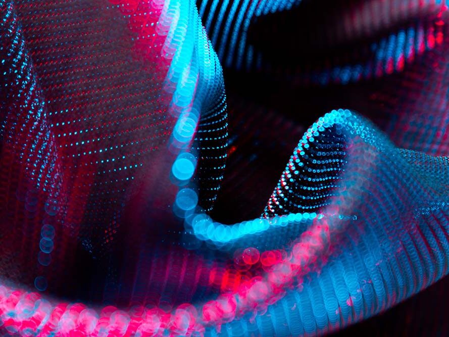 Abstract pink-blue light point waves in a dynamic structure.