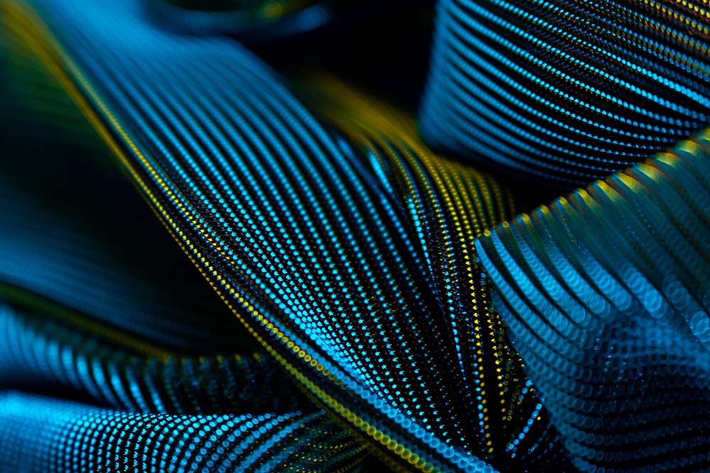 Abstrakte blaue und gelbe Linien aus digitalen Punktmustern.